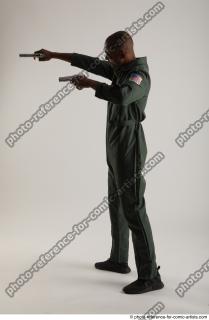 03 2018 01 ERIC STANDING POSE WITH GUNS